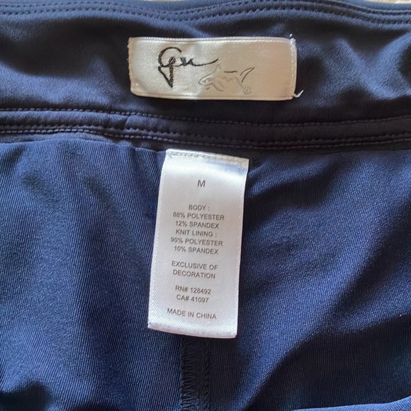 Great Greg Norman navy skort with navy and silver braid around waistband. - Picture 8 of 15